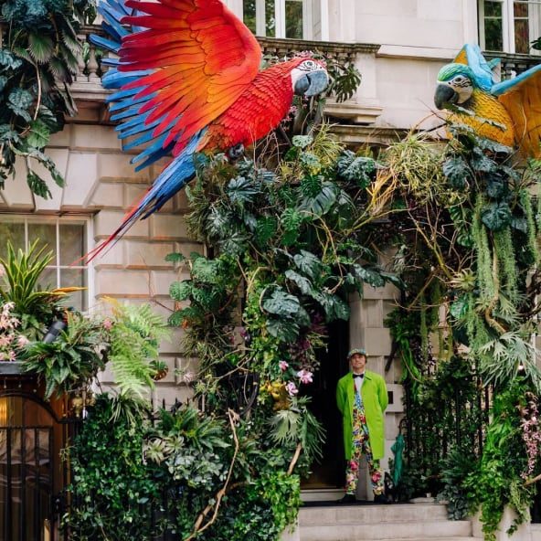 Club facade dressed with foliage and parrots