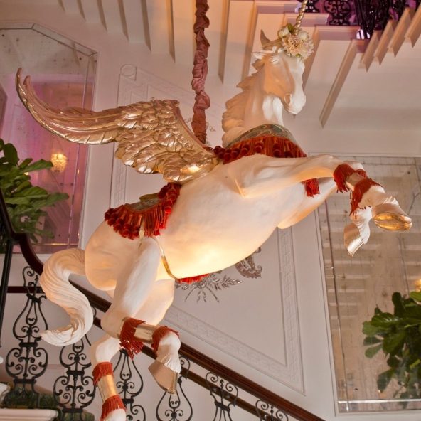 Gilded pegasus sculpture on the staircase